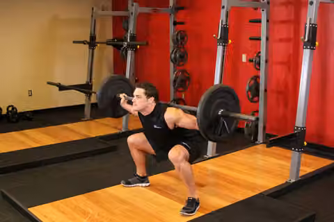 Demonstrasi gerakan Wide Stance Barbell Squat.