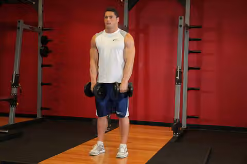 Demonstrasi gerakan Standing Dumbbell Upright Row.