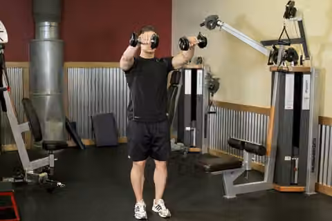 Demonstrasi gerakan Alternating Deltoid Raise.